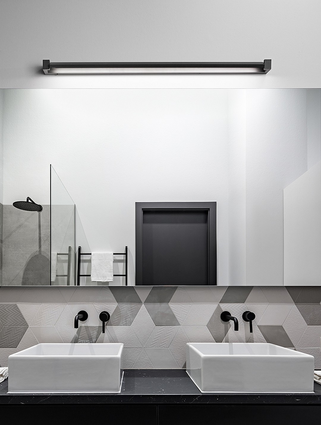 Elegant bathroom in black, white and gray with two washbasins and big mirror
